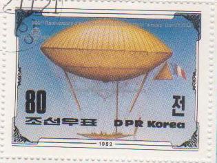 Марка поштова гашена. "Airship by Dupuy de Lome / 1872. 200th Anniversary of The First Manned Balloon Flight. Nov 21 st. 1783. DPR Korea"